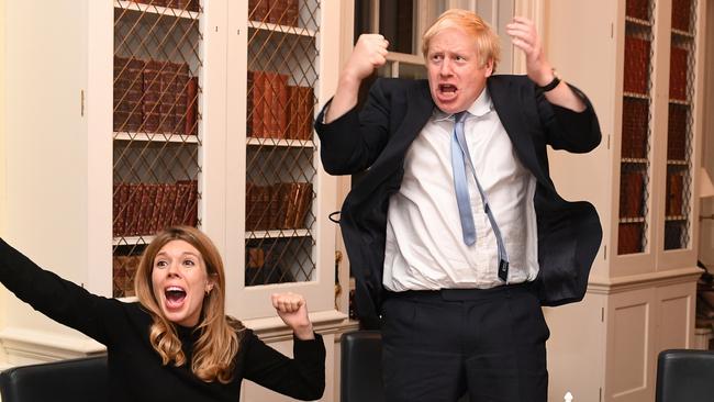 Britain's Prime Minister Boris Johnson and his partner Carrie Symonds watch the 2019 Election results on the TV in his study in No10 Downing Street. Picture by Andrew Parsons / i-Images