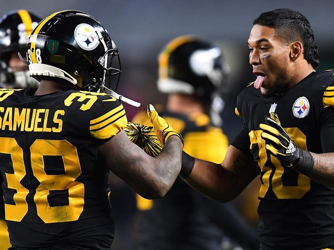 PITTSBURGH, PA - NOVEMBER 08: Jaylen Samuels #38 of the Pittsburgh Steelers celebrates with James Conner #30 after 6 yard touchdown reception during the second half in the game against the Carolina Panthers at Heinz Field on November 8, 2018 in Pittsburgh, Pennsylvania.   Joe Sargent/Getty Images/AFP == FOR NEWSPAPERS, INTERNET, TELCOS & TELEVISION USE ONLY ==