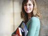 Female University Student with Books and Laptop on Campus