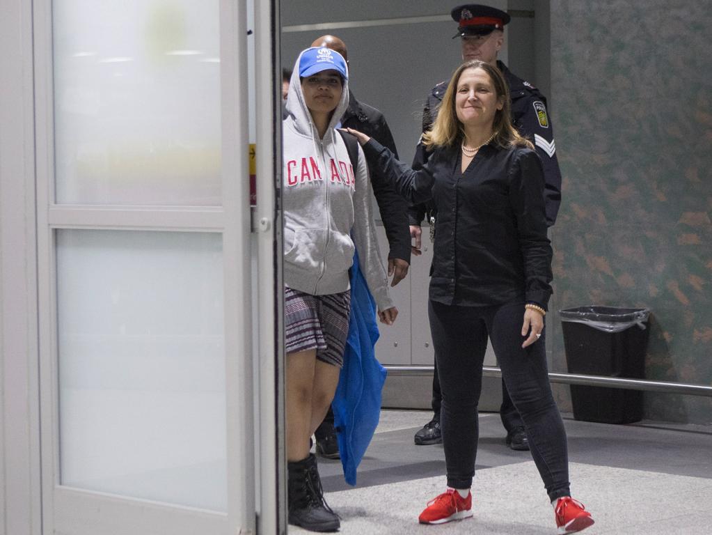 Rahaf Mohammed Alqunun walks with Canadian Minister of Foreign Affairs Chrystia Freeland as she arrives in Toronto. Picture: Chris Young/The Canadian Press