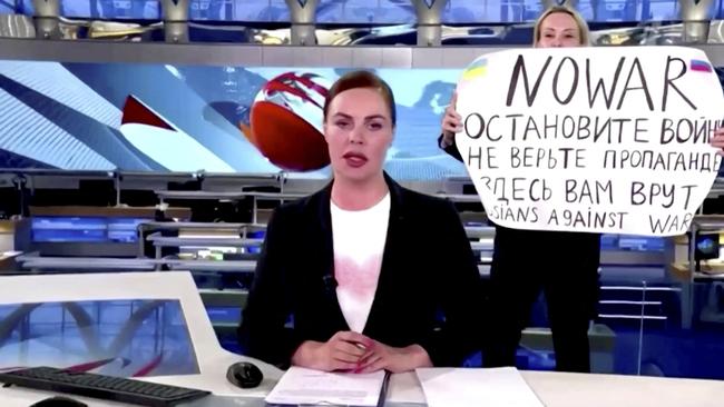 Channel One editor Marina Ovsyannikova interrupts Russia’s most-watched evening news bulletin with an anti-war message: ‘How many more children must die before you will stop?’