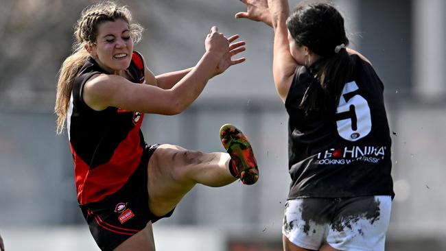 NFL: Eltham’s Angelique Reibelt kicks past St Mary’s Erin Grant. Picture: Andy Brownbill