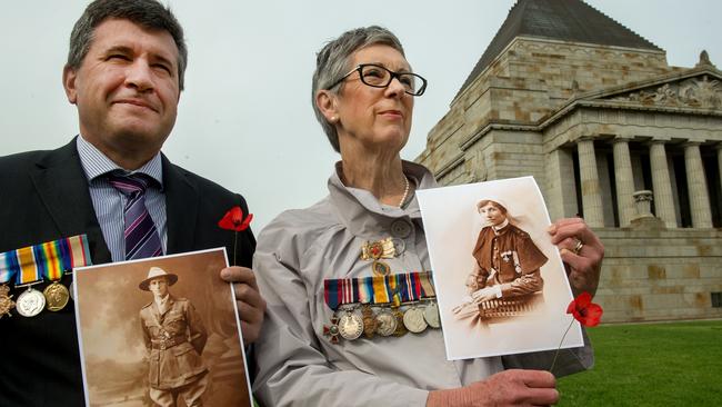 Maggie Johnson and Mark Appleford wearing their grandparents WWI medals at Shrine. Picture: Jay Town