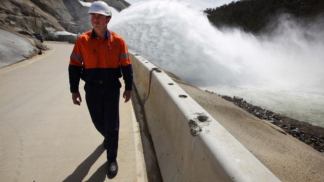 Queensland Hydro chief executive officer Kieran Cusack standing by the radial gates at the Snowy Hydro Jindabyne Dam in NSW where he was formerly area manager. ​