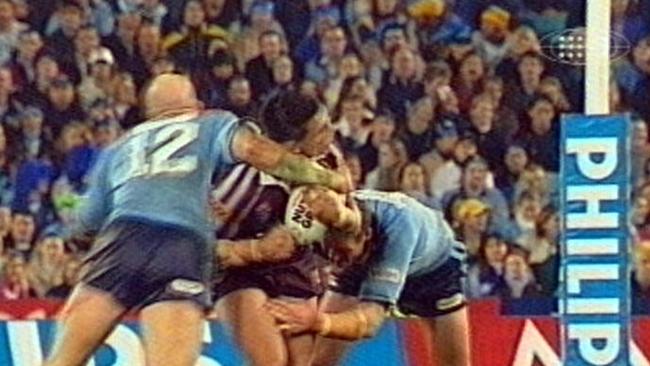 Video still of Steve Price being hit in jaw in high tackle by Ben Kennedy during Game 2 in 2003