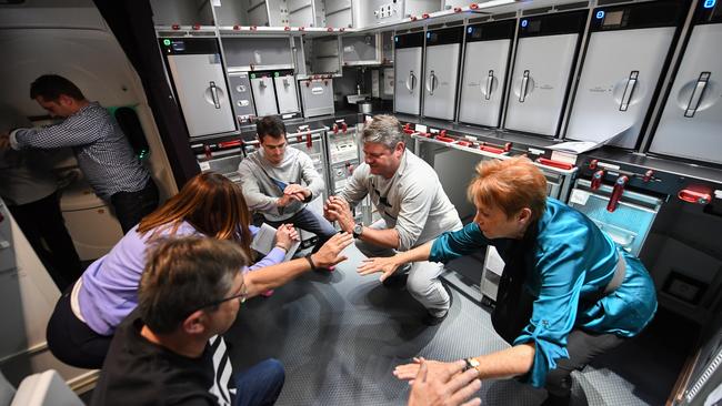 Passengers exercise on board QF7879 from New York to Sydney. Picture: Getty Images