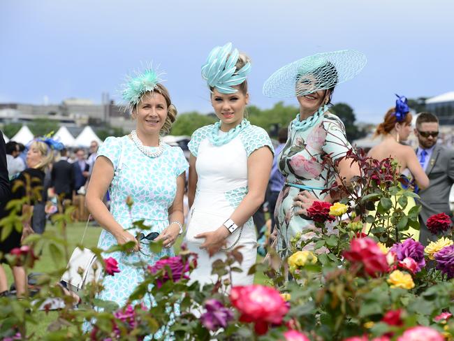 Lana Micalenko, Alex Macor, and Gaylene Thomas all dressed up at Flemington Racecourse on Melbourne Cup Day 2014. Picture: Stephen Harman