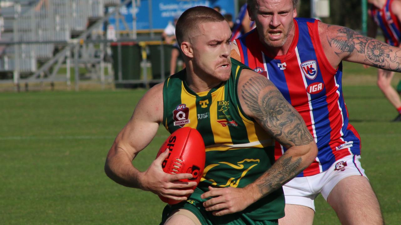 Maroochydore Roos player Sam McKenzie seizes control against Wilston Grange in the QAFL at Maroochydore Multisport Complex. Picture: Tom Threadingham