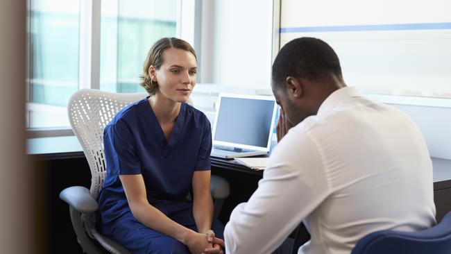 A doctor consults with a male patient. Picture: iStock