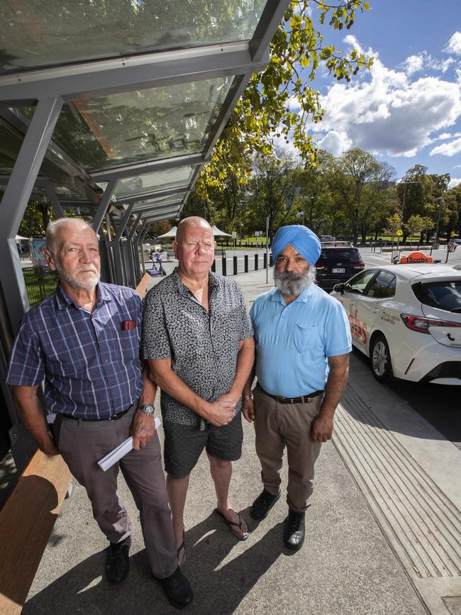 Retired taxi drivers Wim Burman, Guy Sullivan and current driver Harjinder Grewal at Salamanca. Picture: Chris Kidd