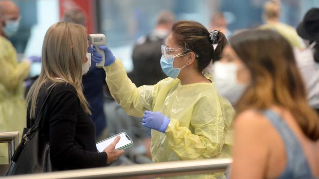 Passengers arriving from Perth at Sydney are screened by NSW Health before entering quarantine. Picture: Jeremy Piper