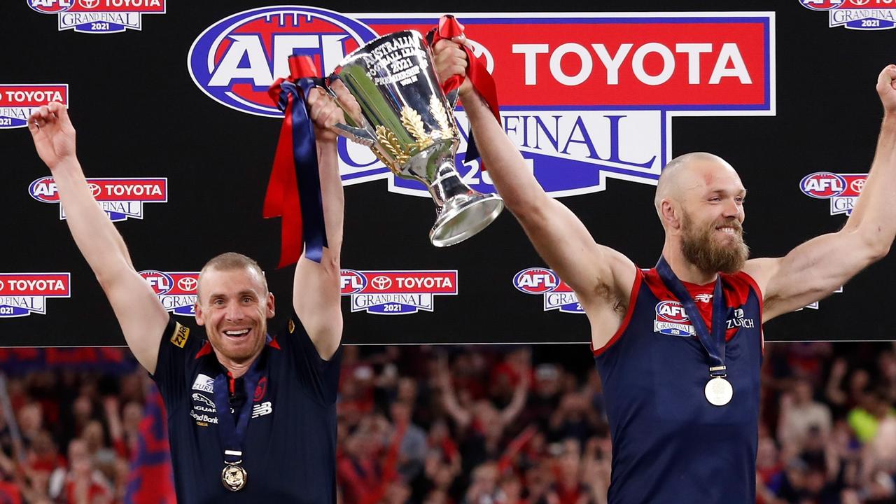 Melbourne coach Simon Goodwin and captain Max Gawn raise the 2021 premiership cup. Pictures: Michael Willson/AFL Photos via Getty Images