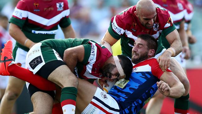 Julian Bousquet of France is driven back by some tough Lebanese defence.