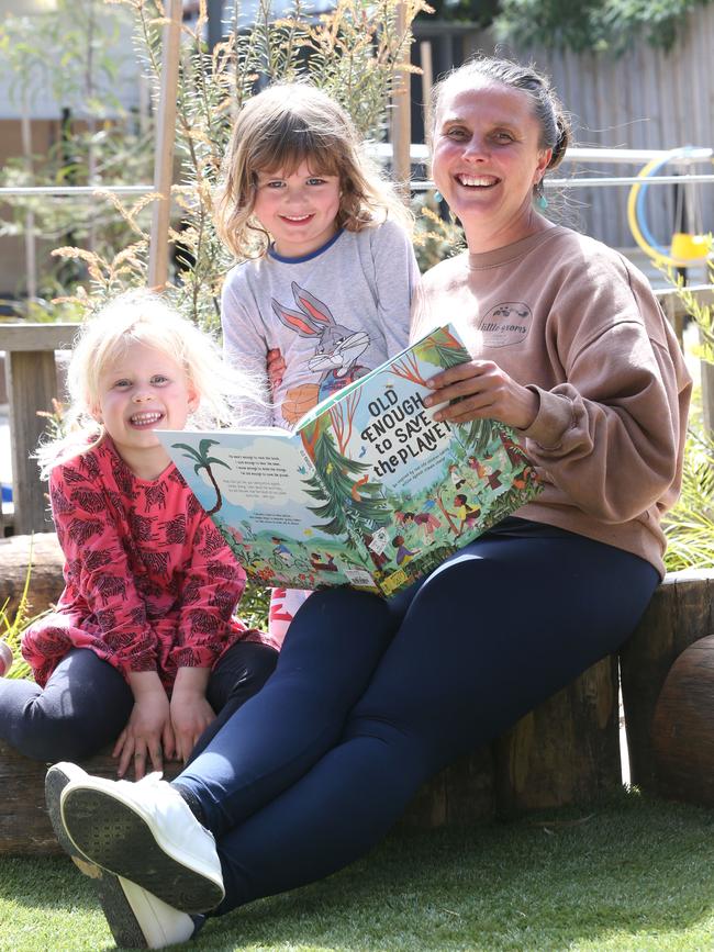 Little Groms Early Learning and Kindergarten Teacher Skie Peterson with Piper Roberts, 4, and Rowdy Stevens, 4. Picture: Mike Dugdale