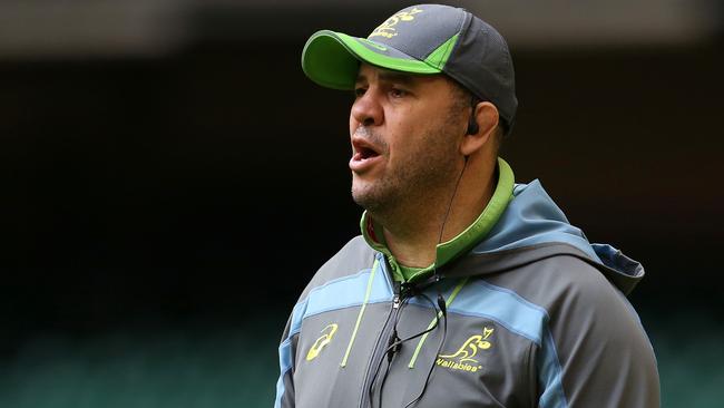 Australia's coach Michael Cheika looks on as Australian players train at the Principality stadium in Cardiff on November 4, 2016 on the eve of their international match against Wales. The two teams will compete for the James Bevan Trophy, which was created in 2007 to celebrate 100 years of rugby between Wales and Australia. / AFP PHOTO / GEOFF CADDICK