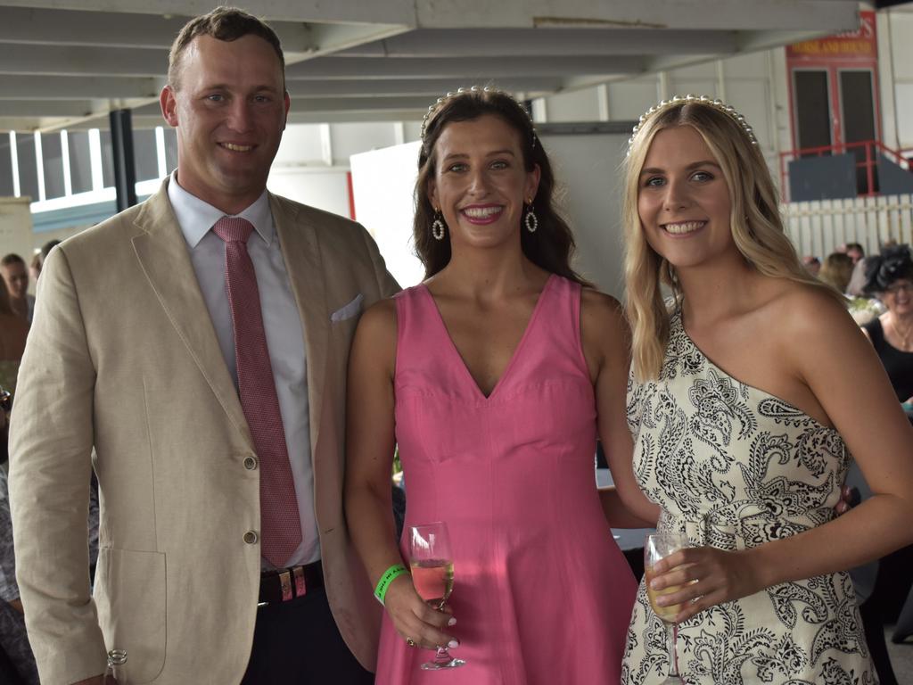 Josh Heck, Kate Matthews and Catie Loch at The Archer race meeting at Callaghan Park, Rockhampton, on May 7, 2022.