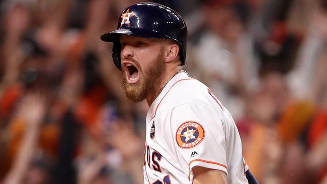 Houston Astro Derek Fisher celebrates after scoring the winning run during the tenth inning against the Los Angeles Dodgers in game five of the 2017 World Series. (Photo by Christian Petersen/Getty Images)