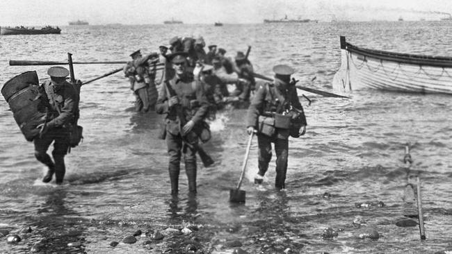 Divisional headquarters staff wade ashore at Anzac Cove on April 25, 1915. PHOTOGRAPH BY CHARLES EDWIN WOODROW BEAN