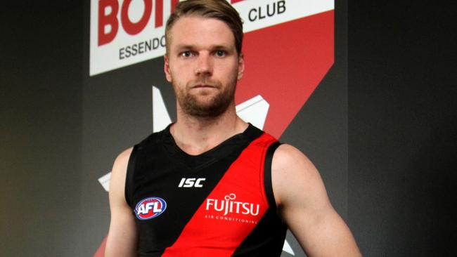 Essendon recruit Jake Stringer tries on his new colours. Picture: essendonfc.com.au