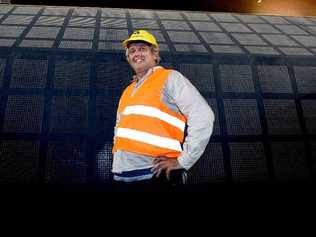 LISMORE CITY HALL: Refurbishment site manager Padraic Barrett (main picture) in front of state of the art acoustic panelling and above, artist impressions of the new-look hall. Picture: Cathy Adams