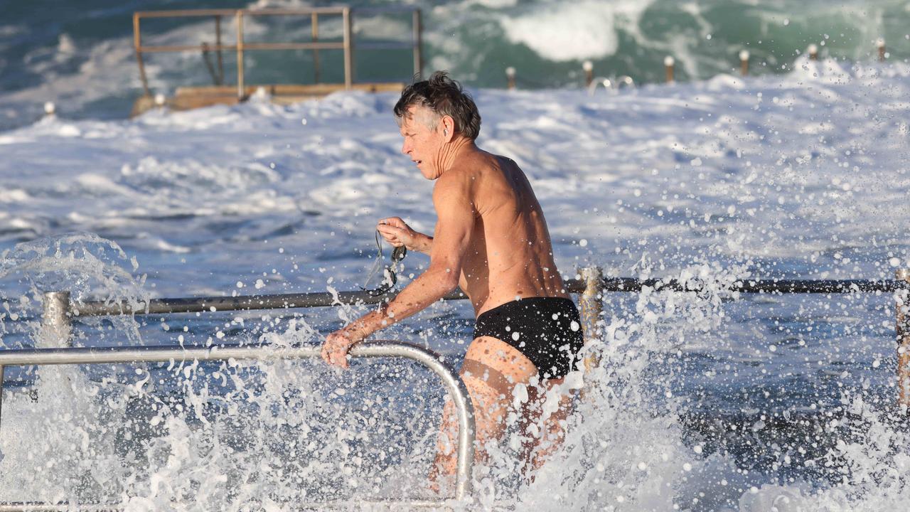 Five young people were rescued by off-duty surf lifesavers from Dee Why SLSC on Sunday night. Picture: David Swift