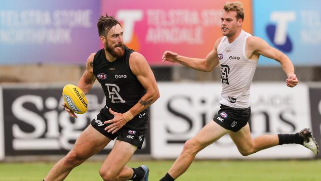 Watts (right) pursues Charlie Dixon during the Power’s intraclub trial in February. Picture: Matt Turner/AFL Photos via Getty Images