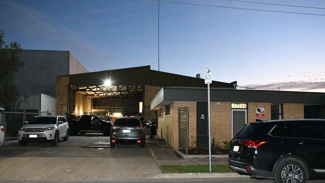 Police searching the Dry Creek complex next door to the Descendants clubrooms. Picture: Australian Federal Police