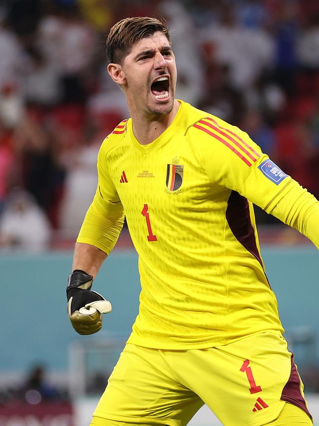 Thibaut Courtois enjoys his penalty save.