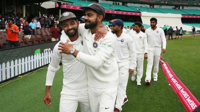 Rahane (left) and Virat Kohli celebrate India’s historic series win on their last tour of Australia. Picture: Getty