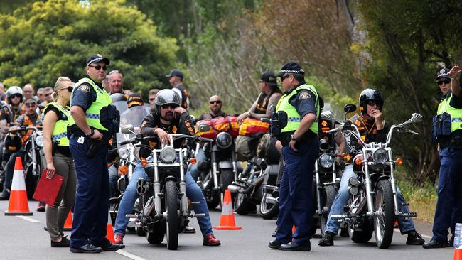 Police keep an eye on the Bandidos motorcycle gang as they arrive in Burnie for their national ride in November 2017. Picture: CHRIS KIDD