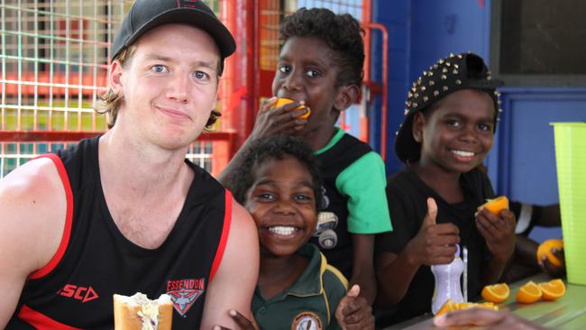 Darcy Parish has lunch with school students at Maningrida in Arnhem Land. Picture: NATALIE MacGREGOR