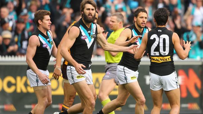 MELBOURNE, AUSTRALIA - SEPTEMBER 20: Travis Boak of the Power is congratulated by team mates after scoring a goal during the AFL 2nd Preliminary Final match between the Hawthorn Hawks and the Port Adelaide Power at Melbourne Cricket Ground on September 20, 2014 in Melbourne, Australia. (Photo by Quinn Rooney/Getty Images)