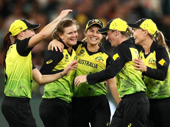 MELBOURNE, AUSTRALIA - MARCH 08: Jess Jonassen of Australia celebrates dismissing Radha Yadav of India with Beth Mooney of Australia after she caught her during the ICC Women's T20 Cricket World Cup Final match between India and Australia at the Melbourne Cricket Ground on March 08, 2020 in Melbourne, Australia. (Photo by Cameron Spencer/Getty Images)