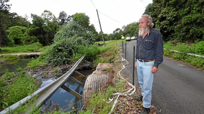 WAITING, WAITING: Concerned resident Murray Ings at the bridge on Mountain Top Road near Jiggi where the barrier was washed away by the rains in March 2017. Picture: Marc Stapelberg