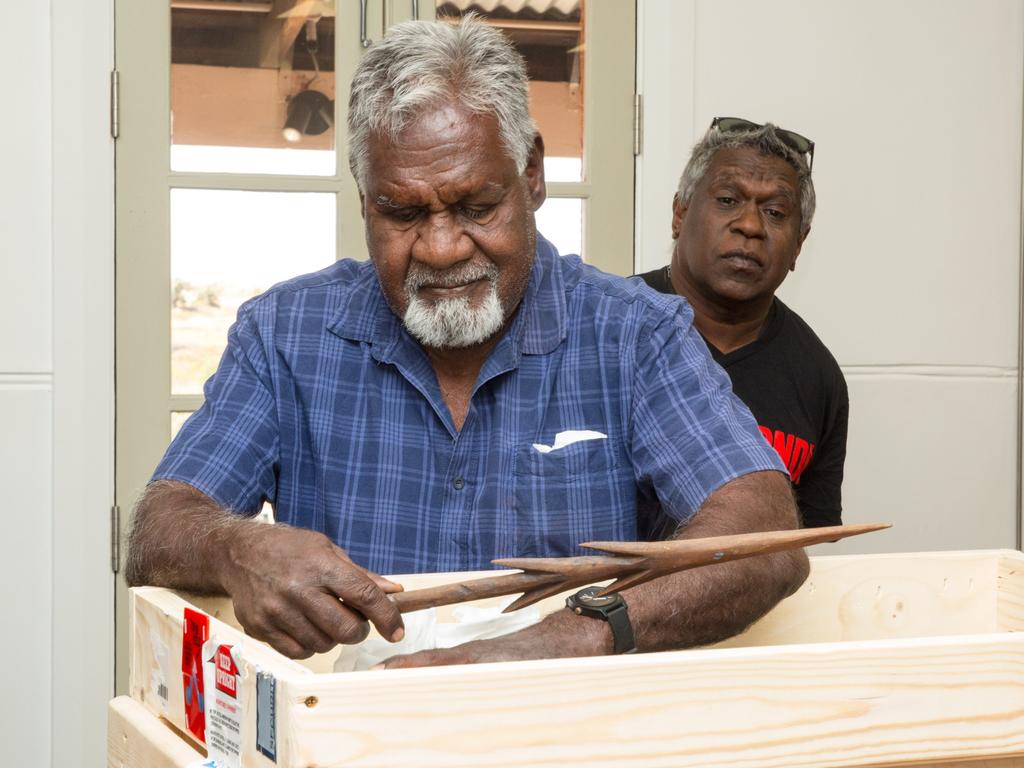 Yinjibarndi leader Michael Woodley unpacks return of cultural heritage material, Representatives of the Yindjibarndi community gathered in Roebourne WA to celebrate the unconditional return of eight secular items from Andover, United Kingdom (UK)., The return is the first repatriation from a private collector under the newly extended Return of Cultural Heritage (RoCH) initiative led by the Australian Institute of Aboriginal and Torres Strait Islander Studies (AIATSIS)., The repatriated items include a shield, spear thrower, two boomerangs and four wooden spear heads. The items had been in the care of the collector and his family for over a century before being returned to Traditional Custodians.