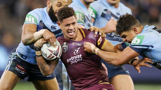 Dane Gagai tackled by Latrell Mitchell and Josh Addo-Carr. Picture: Michael Klein