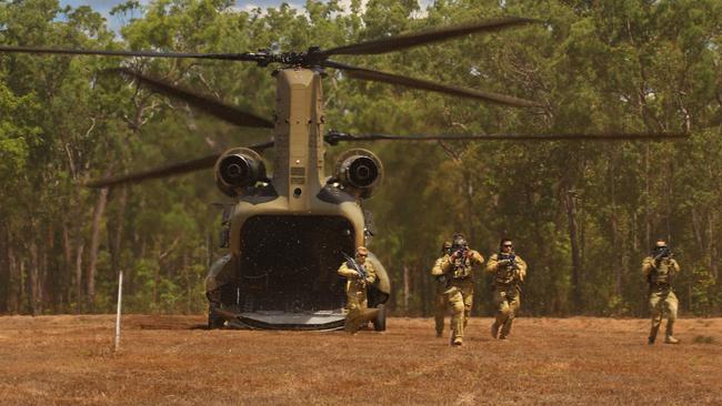 Soldiers from the 3rd Battalion, The Royal Australian Regiment are dropped into the RAAF Base Scherger training area by an Australian Army CH-47F Chinook helicopter from the 5th Aviation Regiment during Exercise Woomera Strike 2021. Photo: Defence Media