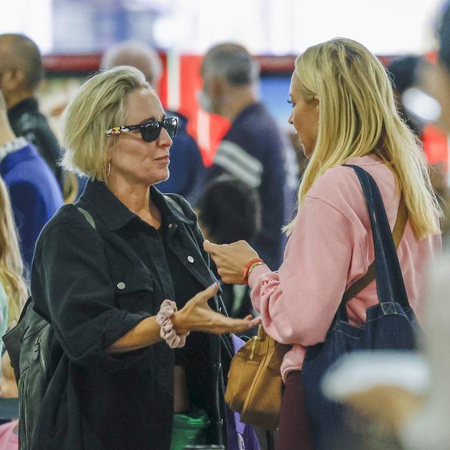 The longtime friends greet each other at the airport. Picture: MEDIA-MODE