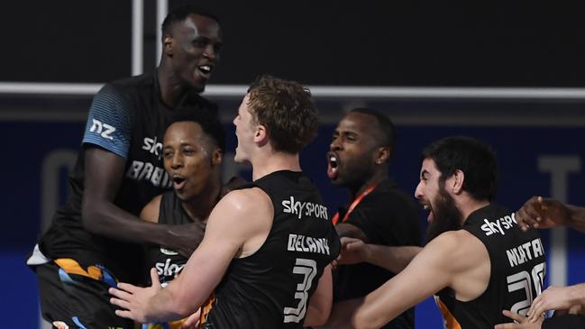 New Zealand Breakers players mob Scotty Hopson after he scored the matchwinner. Picture: Getty Images