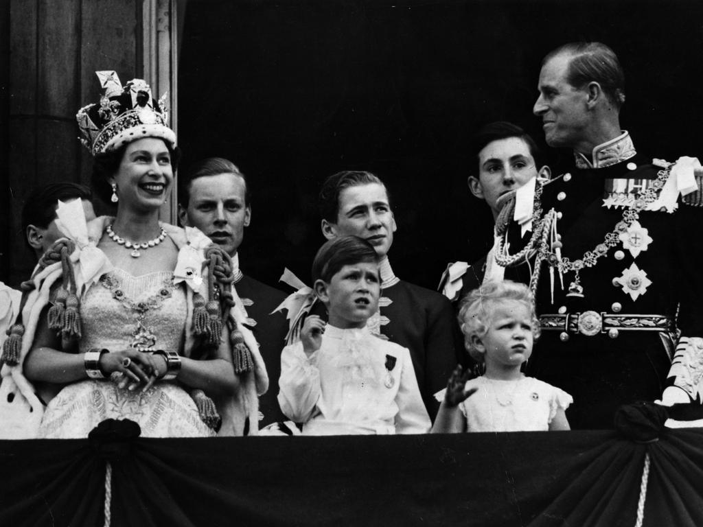 Queen Elizabeth II on the balcony of Buckingham Palace after her coronation ceremony with Prince Charles, Princess Anne and Prince Philip. Picture: Fox Photos/Getty Images