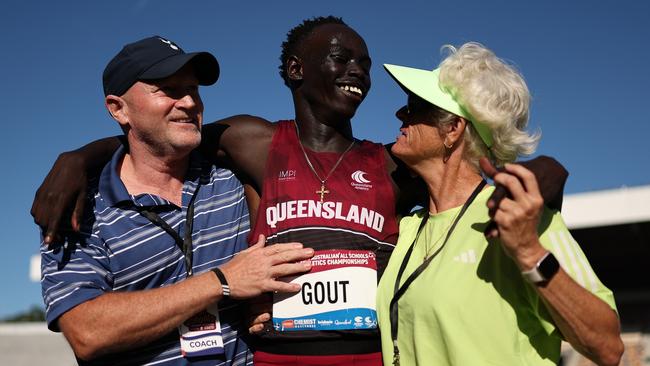 Gout Gout celebrates with his manager James Templeton (L) and coach Di Sheppard (R). (Photo by Cameron Spencer/Getty Images)