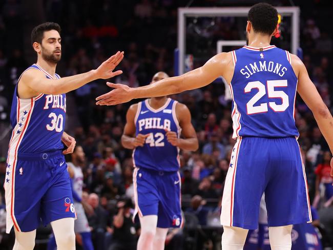 DETROIT, MICHIGAN - DECEMBER 23: Furkan Korkmaz #30 of the Philadelphia 76ers celebrates a first half basket with Ben Simmons #25 while playing the Detroit Pistons at Little Caesars Arena on December 23, 2019 in Detroit, Michigan.  NOTE TO USER: User expressly acknowledges and agrees that, by downloading and or using this photograph, User is consenting to the terms and conditions of the Getty Images License Agreement. (Photo by Gregory Shamus/Getty Images)