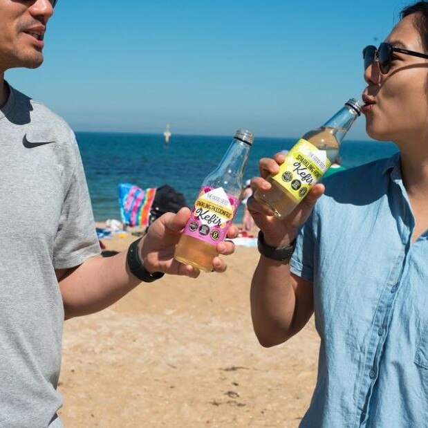 The couple are ‘over the moon’ to have their health and wellbeing drink hit Coles shelves. Cheers to that! Picture: Supplied