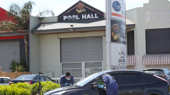 Forensic officers at the scene in Ravenhall. Picture: David Crosling