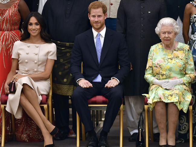 The Queen, far right, is yet to confirm the terms of ‘Megxit’. Picture: AP, File