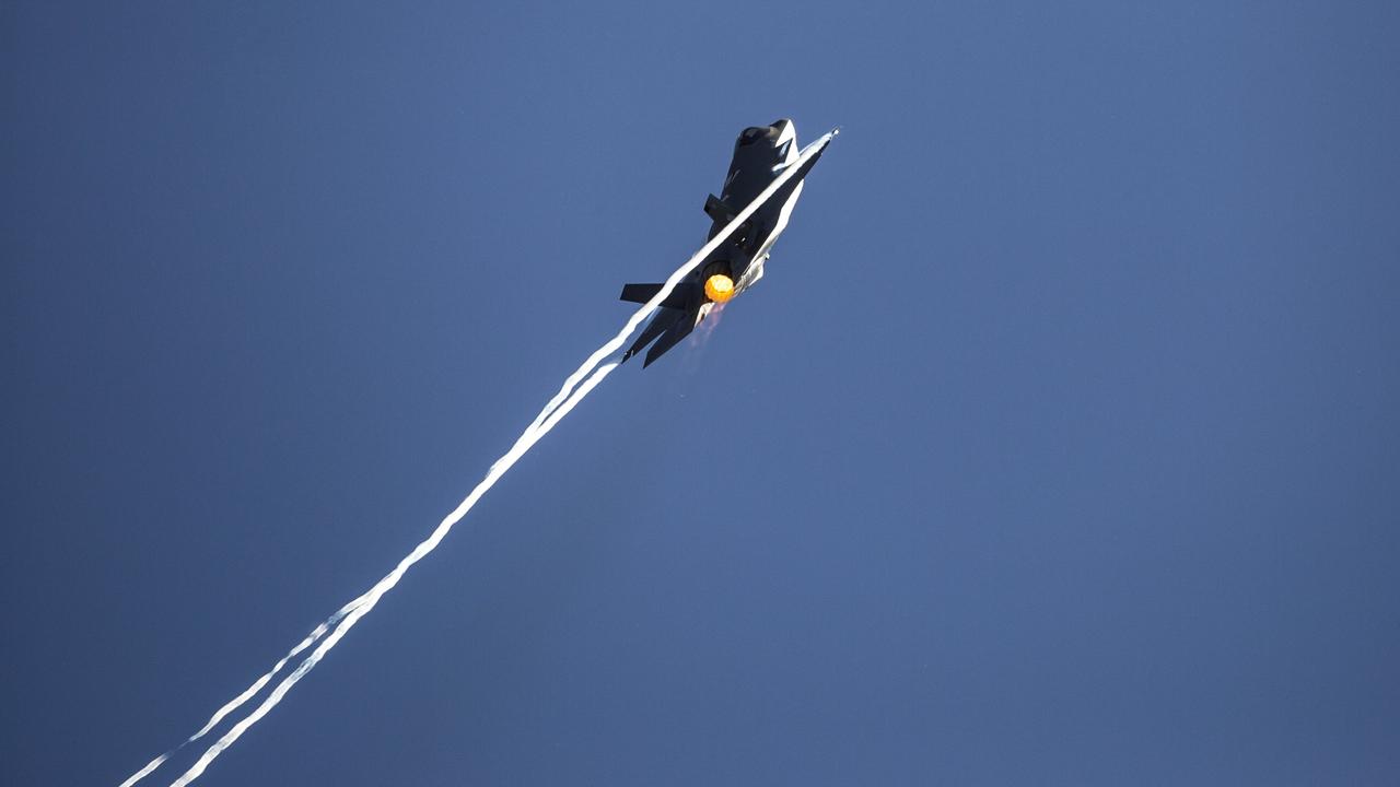 A RAAF F-35A Joint Strike Fighter leaves contrails during its flying display in the Australian Defence Force showcase rehearsal at Avalon, Victoria.