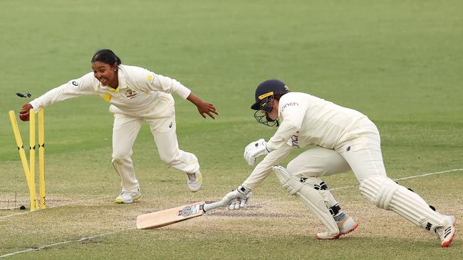 Australia’s Alana King runs out Anya Shrubsole of England in the Manuka Test