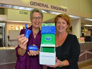 Lismore mayor Jenny Dowell and the council's customer services officer, Sheree Casey, encourage people to grab a free portable butt bin from council's offices as part of the National Butt Free Day awareness campaign.