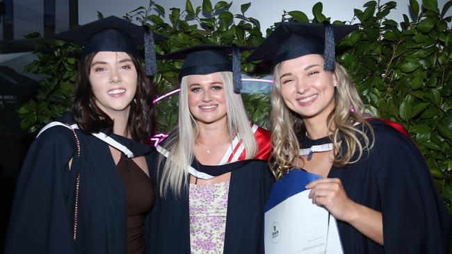 Eryn Cork, Tamika Sommerville and Alexandra Beric celebrate graduation. Picture: Alan Barber