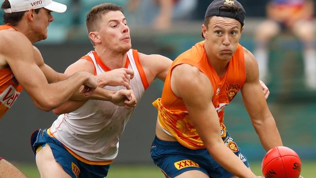 Dayne Zorko tackles Hugh McCluggage during pre-season training.